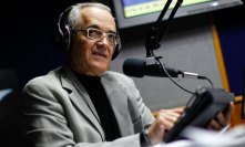 Reporter Bocaranda talks during his radio program in Caracas