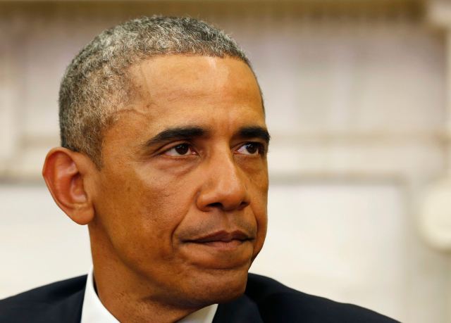 U.S. President Barack Obama makes a statement about the mass shooting in Paris, while in the Oval Office at the White House in Washington