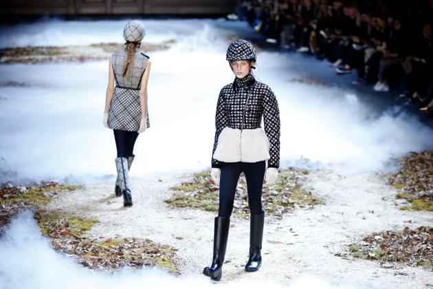 Models present creations by Italian designer Giambattista Valli as part of his Autumn/Winter 2015/2016 women's ready-to-wear collection for fashion house Moncler Gamme Rouge in Paris