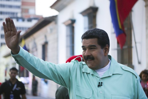 Venezuela's President Nicolas Maduro waves during his weekly broadcast "en contacto con Maduro" (In contact with Maduro) in Caracas