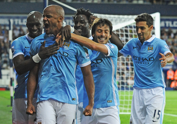 Manchester City’s Vincent Kompany, 2nd left, celebrates scoring with teammates during the English Premier League soccer match between West Bromwich Albion and Manchester City at the Hawthorns, West Bromwich, England, Monday, Aug. 10, 2015. (AP Photo/Rui Vieira)