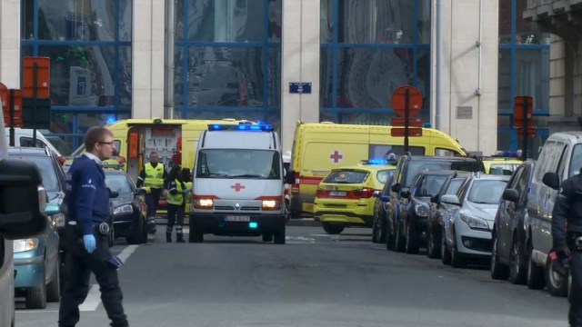 Emergency personnel are seen at the scene of a blast outside a metro station in Brussels, in this still image taken from video on March 22, 2016. REUTERS/Reuters TV