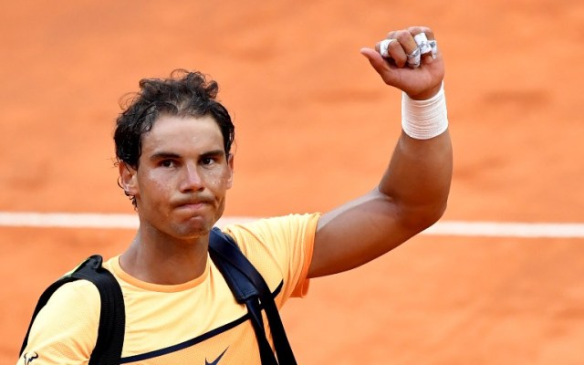Spain's Rafael Nadal waves after losing his match against Serbia's Novak Djokovic during the ATP Tennis Open tournament at the Foro Italico, on May 13, 2016 in Rome. / AFP PHOTO / TIZIANA FABI