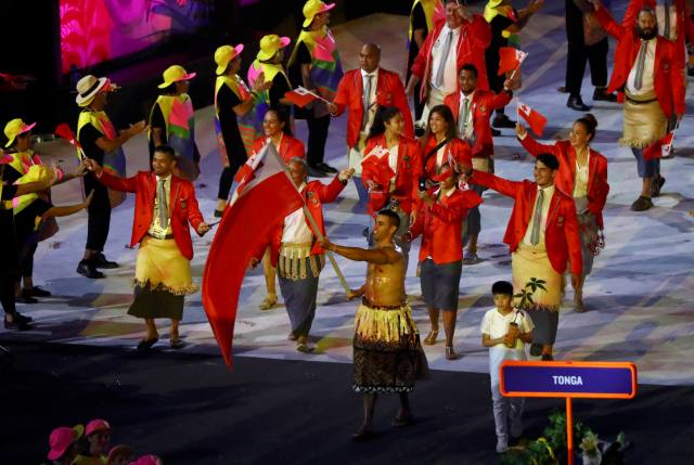 2016 Rio Olympics - Opening ceremony - Maracana - Rio de Janeiro, Brazil - 05/08/2016. Flagbearer Pita Nikolas Taufatofua (TGA) of Tonga leads his contingent during the opening ceremony. REUTERS/Mike Blake FOR EDITORIAL USE ONLY. NOT FOR SALE FOR MARKETING OR ADVERTISING CAMPAIGNS.