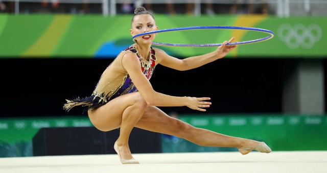 2016 Rio Olympics - Rhythmic Gymnastics - Preliminary - Individual All-Around Qualification - Rotation 1 - Rio Olympic Arena - Rio de Janeiro, Brazil - 19/08/2016. Melitina Staniouta (BLR) of Belarus competes using the hoop. REUTERS/Mike Blake  FOR EDITORIAL USE ONLY. NOT FOR SALE FOR MARKETING OR ADVERTISING CAMPAIGNS.