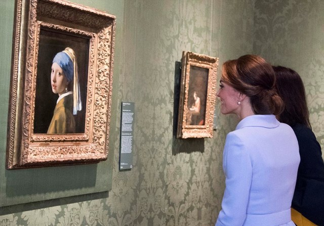 Her Royal Highness The Duchess of Cambridge visited the Mauritshuis in The Hague, Netherlands. The visit was planned to coincide with the exhibition At Home in Holland: Vermeer and his contemporaries from the Royal Collection, which includes important genre paintings from the Queens collection. The Duchess of Cambridge was received by director Emilie Gordenker, who gave her a tour of highlights in the Mauritshuis, which includes the Girl with a Pearl Earring by Johannes Vermeer, The Goldfinch by Carel Fabritius, and The Bull by Paulus Potter. The Duchess of Cambridge, who took a degree in art history at the University of St Andrews, is familiar with the collection. She also visited the Art Workshop in the Mauritshuis, where children were have a painting lesson. Picture: Arthur Edwards The Sun London