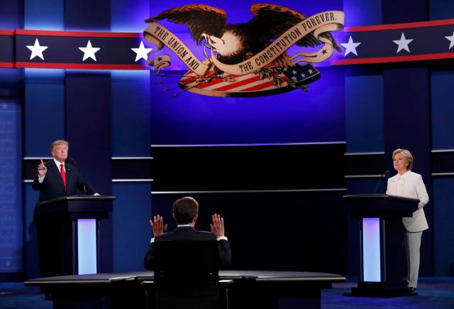 Republican U.S. presidential nominee Donald Trump and Democratic U.S. presidential nominee Hillary Clinton take part in their third and final 2016 presidential campaign debate at UNLV in Las Vegas