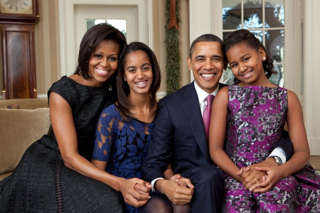 President Barack Obama, First Lady Michelle Obama, and their daughters, Sasha and Malia, sit for a family portrait in the Oval Office, Dec. 11, 2011. (Official White House Photo by Pete Souza) This official White House photograph is being made available only for publication by news organizations and/or for personal use printing by the subject(s) of the photograph. The photograph may not be manipulated in any way and may not be used in commercial or political materials, advertisements, emails, products, promotions that in any way suggests approval or endorsement of the President, the First Family, or the White House.Ê