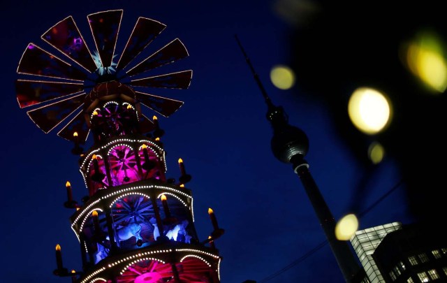 A Christmas pyramid is pictured next to the television tower at the Christmas market at Alexanderplatz square in Berlin, Germany November 21, 2016. REUTERS/Hannibal Hanschke