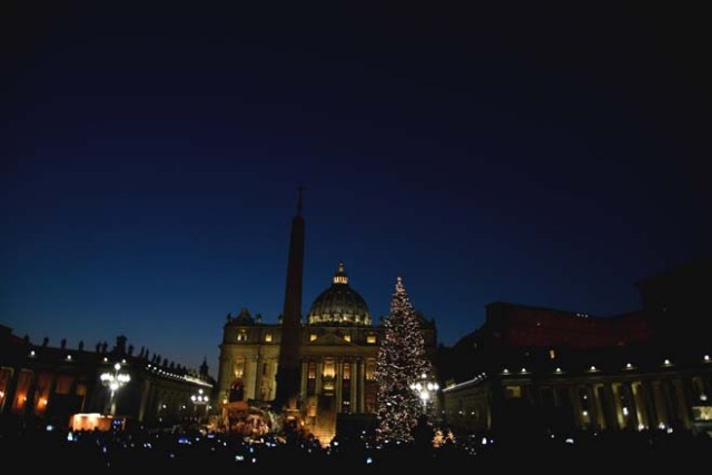 The Christmas tree is pictured at the Saint Peter's square following its illumination on December 9, 2016 in Vatican. This year, the Christmas ornaments were made by children of the paediatric oncology departments of Italian hospitals. / AFP PHOTO / VINCENZO PINTO