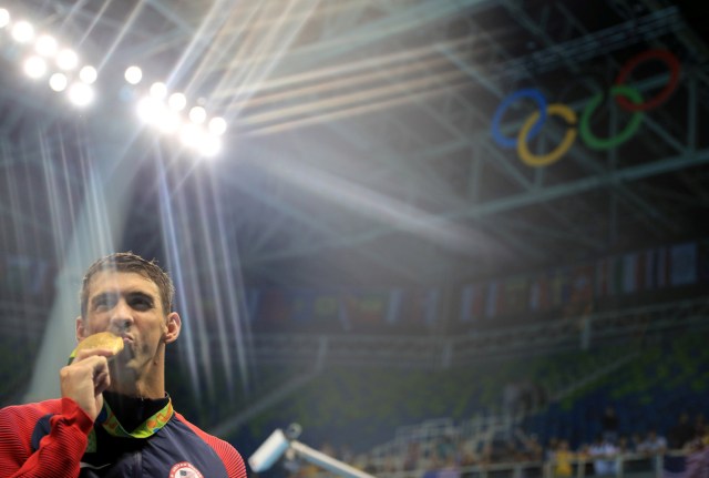 FILE PHOTO - 2016 Rio Olympics - Swimming - Victory Ceremony - Men's 4 x 200m Freestyle Relay Victory Ceremony - Olympic Aquatics Stadium - Rio de Janeiro, Brazil - 09/08/2016. Michael Phelps (USA) of USA poses with his gold medal. REUTERS/Dominic Ebenbichler/File Photo FOR EDITORIAL USE ONLY. NOT FOR SALE FOR MARKETING OR ADVERTISING CAMPAIGNS REUTERS PICTURES OF THE YEAR 2016 - SEARCH 'POY 2016' TO FIND ALL IMAGES