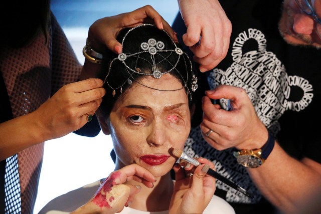 FILE PHOTO - Indian model and acid attack survivor Reshma Quereshi has make up applied before walking to present Indian designer Archana Kochhar's Spring/Summer 2017 collections during New York Fashion Week in the Manhattan borough of New York, U.S., September 8, 2016. REUTERS/Lucas Jackson/File Photo REUTERS PICTURES OF THE YEAR 2016 - SEARCH 'POY 2016' TO FIND ALL IMAGES