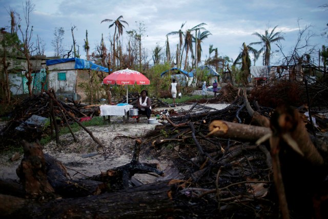 FILE PHOTO - A food vendor waits for customers after Hurricane Matthew hit Jeremie, Haiti, October 18, 2016. REUTERS/Carlos Garcia Rawlins/File Photo REUTERS PICTURES OF THE YEAR 2016 - SEARCH 'POY 2016' TO FIND ALL IMAGES