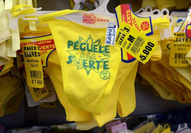 View of yellow underwear for sell at a store in Medellin, Colombia, on December 29, 2016, where tradition holds that it brings prosperity and good luck if you wear it on New Year's Eve. / AFP PHOTO / CAMILO GIL