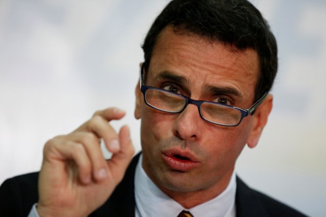 Venezuelan opposition leader and Governor of Miranda state Henrique Capriles talks to the media during a news conference in Caracas