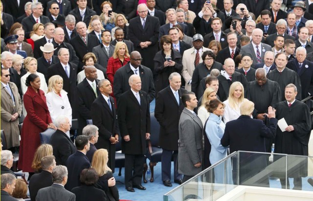 U.S. President Donald Trump takes the oath of office from Supreme Court Chief Justice John Roberts with his wife Melania, and children Barron, Donald Jr, Eric, Ivanka and Tiffany at his side during inauguration ceremonies in Washington, U.S., January 20, 2017. REUTERS/Rick Wilking