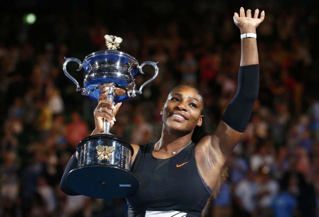 Tennis - Australian Open - Melbourne Park, Melbourne, Australia - 28/1/17 Serena Williams of the U.S. holds her trophy after winning her Women's singles final match against Venus Williams of the U.S. .REUTERS/Edgar Su