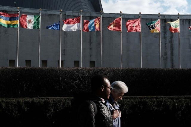 NEW YORK, NY - JANUARY 26: Pedestrians walk by the United Nations in midtown Manhattan on January 26, 2017 in New York City. President Donald Trump is preparing executive orders that would reduce US funding of the United Nations and other international organizations. The first order would cut funding for any U.N. agency or other international group that meets any specific criteria. Organizations and groups to receive cuts may include peacekeeping missions, the International Criminal Court and the United Nations Population Fund. Spencer Platt/Getty Images/AFP