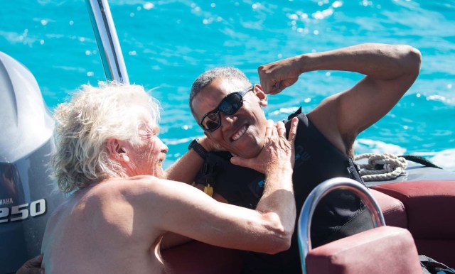 Former U.S. President Barack Obama and British businessman Richard Branson sit on a boat during Obama's holiday on Branson's Moskito island, in the British Virgin Islands, in a picture handed out by Virgin on February 7, 2017. Jack Brockway/Virgin Handout via REUTERS FOR EDITORIAL USE ONLY