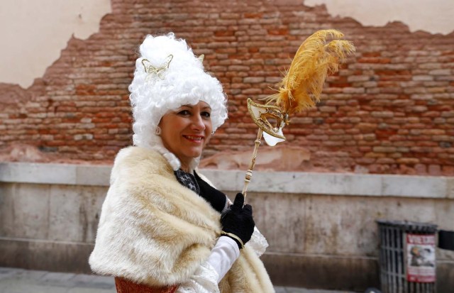 A reveller poses during the Venice Carnival in Venice, Italy February 11, 2017. REUTERS/Tony Gentile