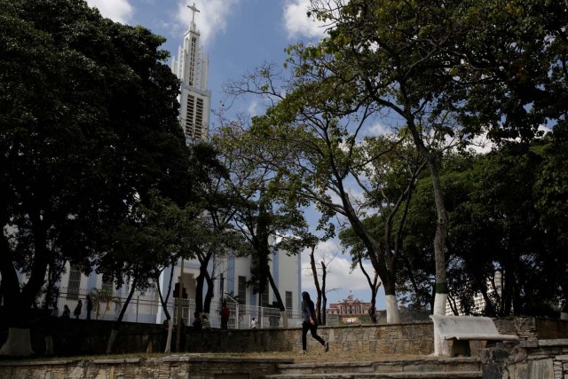 A woman walks past La Paguita church in downtown Caracas, Venezuela February 6, 2017. Picture taken February 6, 2017. REUTERS/Marco Bello