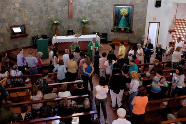 People attend a mass at a church in Santa Fe neighbourhood in Caracas, Venezuela February 12, 2017. REUTERS/Marco Bello