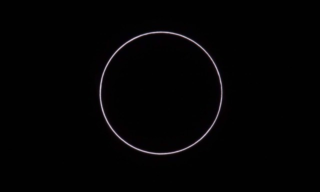 Picture taken on February 26, 2017 showing an annular solar eclipse, as seen from the Estancia El Muster, near Sarmiento, Chubut province, 1600 km south of Buenos Aires, Argentina, on February 26, 2017. Stargazers applauded as they were plunged into darkness Sunday when the moon passed in front of the sun in a spectacular "ring of fire" eclipse. / AFP PHOTO / ALEJANDRO PAGNI