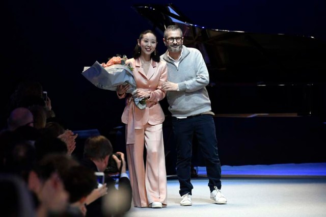 French fashion designer Pascal Millet (R) acknowledges the audience at the end of his women's Fall-Winter 2017-2018 ready-to-wear collection fashion show in Paris on March 2, 2017. / AFP PHOTO / bertrand GUAY