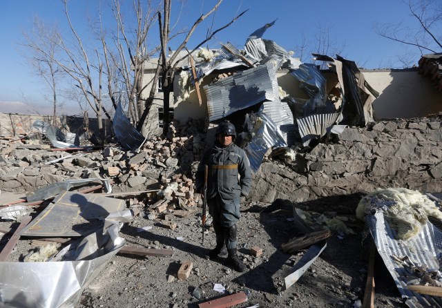 An Afghan policeman stands at the site of yesterday's blast in Kabul, Afghanistan March 2, 2017. REUTERS/Omar Sobhani