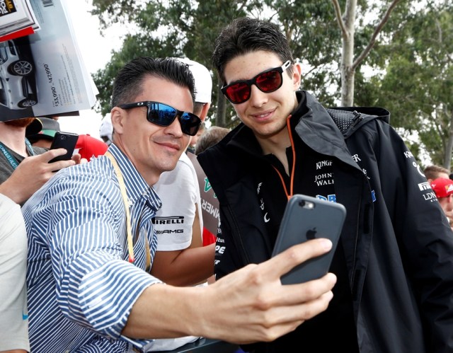 Formula One - F1 - Australian Grand Prix - Melbourne, Australia - 26/03/2017 Force India driver Esteban Ocon (R) arrives at the track. REUTERS/Brandon Malone