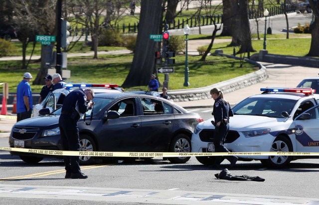 Capitol Hill police inspect a car whose driver struck a Capitol Police cruiser and then tried to run over officers, near the U.S. Capitol in Washington, U.S., March 29, 2017. REUTERS/Joshua Roberts