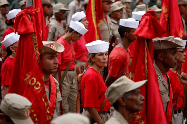 Militia members stand at attention during a ceremony with Venezuela's President Nicolas Maduro at Miraflores Palace in Caracas, Venezuela April 17, 2017. REUTERS/Marco Bello