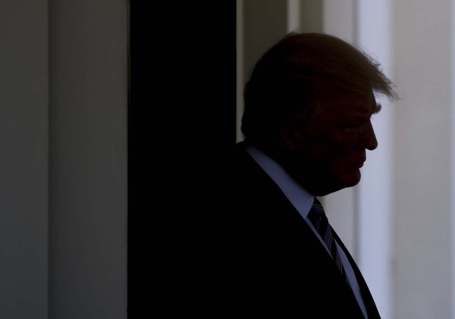 US President Donald Trump escorts Turkish President Recep Tayyip Erdogan (not pictured) to his car following meetings in the West Wing of the White House in Washington, DC, May 16, 2017. / AFP PHOTO / SAUL LOEB