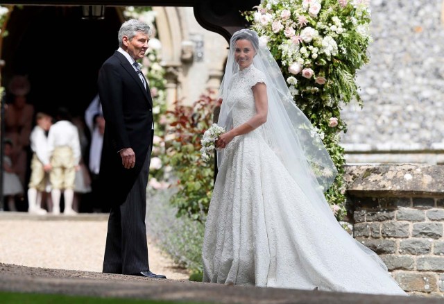 Pippa Middleton, the sister of Britain's Catherine, Duchess of Cambridge, arrives with her father Michael Middleton for her wedding to James Matthews at St Mark's Church in Englefield, west of London, on May 20, 2017. REUTERS/Kirsty Wigglesworth/Pool