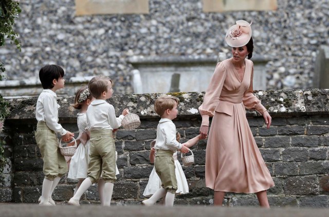 Britain's Catherine, Duchess of Cambridge walks with the flower boys and girls after the wedding of Pippa Middleton and James Matthews at St Mark's Church in Englefield, west of London, on May 20, 2017. REUTERS/Kirsty Wigglesworth/Pool