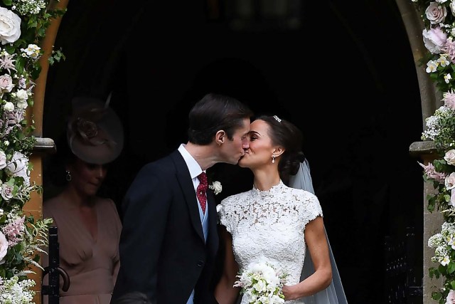 Pippa Middleton kisses her new husband James Matthews, following their wedding ceremony at St Mark's Church in Englefield, west of London, on May 20, 2017. REUTERS/Justin Tallis/Pool