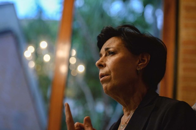 Antonieta Mendoza, mother of Venezuelan opposition leader Leopoldo Lopez, gestures as he speaks during an interview with AFP in Caracas on July 13, 2017. Lopez, a 46-year-old Harvard-educated politician, was imprisoned for more than three-and-a-half years for allegedly inciting violence by calling for anti-government protests. Today the most prominent opponent of Venezuela's President Nicolas Maduro, spends his first days of house arrest playing with his children, and gradually resumes political activity, holding meetings with international leaders regarding the country's severe crisis. / AFP PHOTO / FEDERICO PARRA