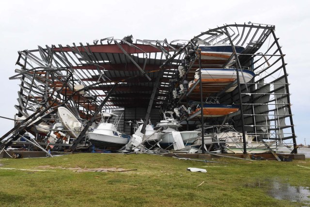 Damaged multi-level storage facility and boats are seen following passage of Hurricane Harvey at Rockport, Texas on August 26, 2017. / AFP PHOTO