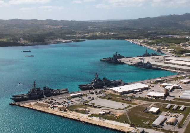 FILE PHOTO: Navy vessels are moored in port at the U.S. Naval Base Guam at Apra Harbor, Guam March 5, 2016. Major Jeff Landis,USMC (Ret.)/Naval Base Guam/Handout/File Photo via REUTERS. ATTENTION EDITORS - THIS IMAGE WAS PROVIDED BY A THIRD PARTY