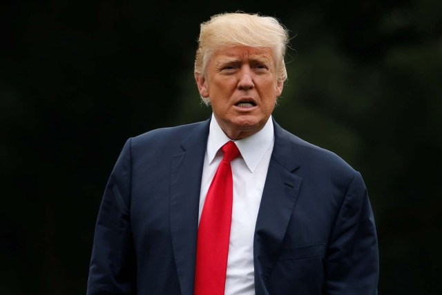 U.S. President Donald Trump listens to reporters shout questions as he arrives via Marine One at the White House in Washington, U.S. August 14, 2017.  REUTERS/Jonathan Ernst