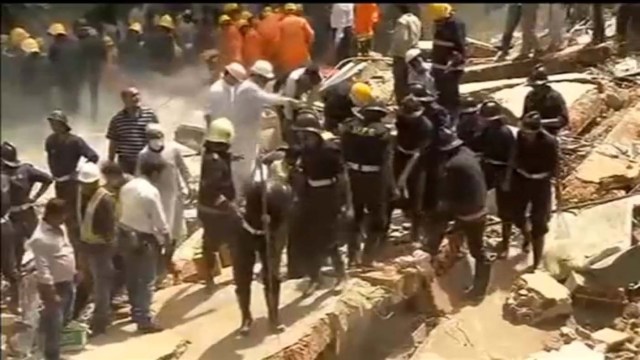 People and rescue personnel take part in a rescue operation amid rubble after a building collapsed in Mumbai, India in this still frame taken from video August 31, 2017. ANI/via REUTERS TV ATTENTION EDITORS - THIS IMAGE HAS BEEN PROVIDED BY A THIRD PARTY. NO RESALES. NO ARCHIVE. BROADCASTERS: NO ACCESS MEDIACORP/BBC DIGITAL: NO ACCESS MEDIACORP/BBC. FOR REUTERS CUSTOMERS ONLY. NO THIRD PARTY SALES. NOT FOR USE BY REUTERS THIRD PARTY DISTRIBUTORS