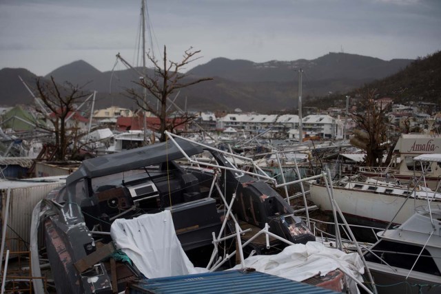 General view of wrecked boats in Geminga shipyard in Marigot, taken on September 9, 2017 in Saint-Martin island devastated by Irma hurricane. Officials on the island of Guadeloupe, where French aid efforts are being coordinated, suspended boat crossings to the hardest-hit territories of St. Martin and St. Barts where 11 people have died. Two days after Hurricane Irma swept over the eastern Caribbean, killing at least 17 people and devastating thousands of homes, some islands braced for a second battering from Hurricane Jose this weekend. / AFP PHOTO / Martin BUREAU