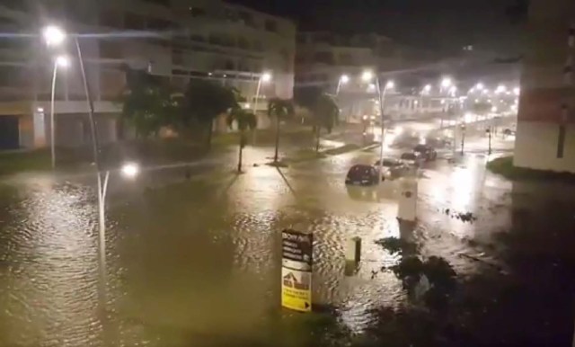 This handout picture obtained from a video released on September 19, 2017, on the Twitter account of Yves Thole shows a flooded street in Pointe-a-Pitre after the powerful winds and rain of hurricane Maria battered the French overseas Caribbean island of Guadeloupe. Hurricane Maria strengthened into a "potentially catastrophic" Category Five storm as it barrelled into eastern Caribbean islands still reeling from Irma, forcing residents to evacuate in powerful winds and lashing rain. / AFP PHOTO / TWITTER / Yves THOLE / RESTRICTED TO EDITORIAL USE - MANDATORY CREDIT "AFP PHOTO / TWITTER / YVES THOLE" - NO MARKETING NO ADVERTISING CAMPAIGNS - DISTRIBUTED AS A SERVICE TO CLIENTS