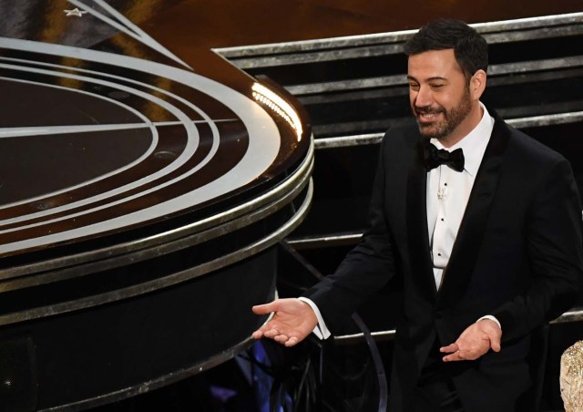 (FILES) This file photo taken on February 26, 2017 shows Host Jimmy Kimmel reacting after the 89th Oscars in Hollywood, California. Late-night comedian Jimmy Kimmel has emerged as the unlikely town crier against the latest Republican plan to overhaul Obamacare, highlighting his son's heart disease in an emotional new appeal to salvage America's health care system. For two straight nights he has stood on stage at an ABC studio in Los Angeles and, using his own son's harrowing story as an example of the extraordinary costs of emergency treatment, argued that poor and middle class families would be priced out of health care under the new plan. / AFP PHOTO / Mark RALSTON