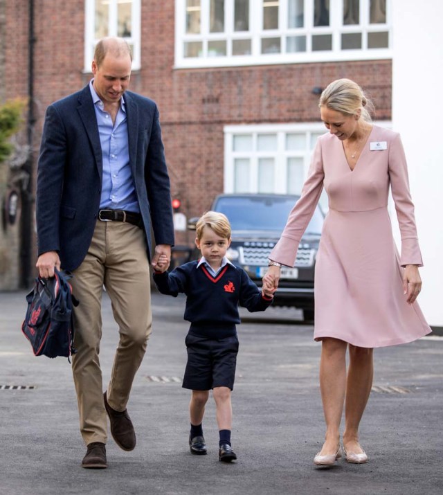 Helen Haslem, head of the lower school and Britain's Prince William hold Prince George's hands as he arrives for his first day of school at Thomas's school in Battersea, London, September 7, 2017. REUTERS/Richard Pohle/Pool