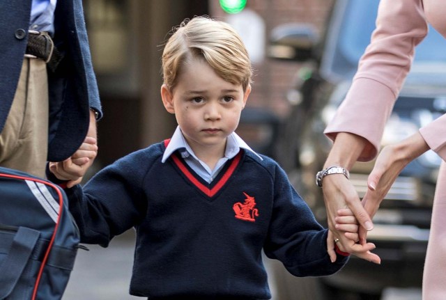 Helen Haslem, head of the lower school and Britain's Prince William hold Prince George's hands as he arrives for his first day of school at Thomas's school in Battersea, London, September 7, 2017. REUTERS/Richard Pohle/Pool