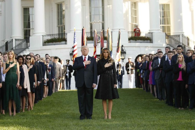 U.S. President Donald Trump and first lady Melania Trump lead a moment of silence to mark the 16th anniversary of the September 11 attacks at the White House in Washington, U.S., September 11, 2017. REUTERS/Kevin Lamarque