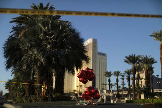 A makeshift memorial is seen next to the site of the Route 91 music festival mass shooting outside the Mandalay Bay Resort and Casino in Las Vegas, Nevada, U.S., October 3, 2017. REUTERS/Lucy Nicholson