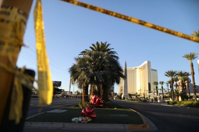 A makeshift memorial is seen next to the site of the Route 91 music festival mass shooting outside the Mandalay Bay Resort and Casino in Las Vegas, Nevada, U.S., October 3, 2017. REUTERS/Lucy Nicholson