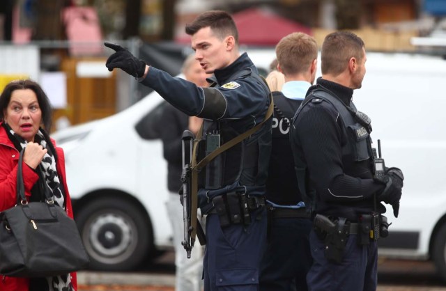 German police officers guard the site where earlier a man injured several people in a knife attack in Munich, Germany, October 21, 2017.